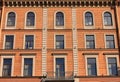 Building facade architecture of old residential house outside.