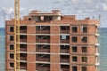 Building facade finished with bricks under construction. Real state Royalty Free Stock Photo