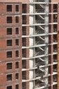 Building facade finished with bricks under construction. Real state. Vertical Royalty Free Stock Photo