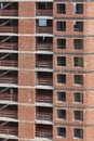 Building facade finished with bricks under construction. Real state. Vertical Royalty Free Stock Photo