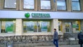 Building facade with logo of largest russian bank Sberbank. Leader of Banking Industry. Financial services. Cityscape. Blurred def