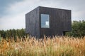 Building facade made of burnt wooden boards.