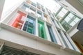 Building facade with multi-colored glass windows Royalty Free Stock Photo