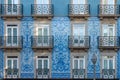 Building facade with typical portuguese tiles azulejos in medieval narrow street in old town of Porto, Portugal with Royalty Free Stock Photo