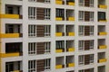 Building facade with windows and yellow balconies. Perspective view pattern. Modern urban architecture background. Mortgage to buy Royalty Free Stock Photo