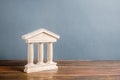 Building figurine with pillars in antique style. Concept of city administration, bank, university, court or library. Architectural Royalty Free Stock Photo