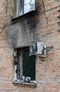 The building after the fire. Burnt window. Ruined house. Catastrophe. Soot on the window