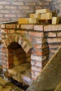 Building a fireplace in a house using old bricks. Beautiful bricklaying Royalty Free Stock Photo
