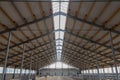 Building frame composition. Steel frame of the building with timber joists and sandwich panels on the roof. Modern construction of