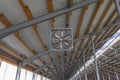 Building frame composition. Steel frame of the building with timber joists and sandwich panels on the roof. Modern construction of