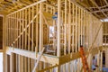 Building frame for a new residential building while it is still under construction with beams fenestrations on a