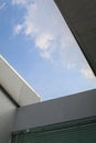 Building a glass roof sky with bright sunshine. White wall interior with big window. Royalty Free Stock Photo