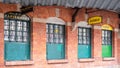 Building with green painted doors at Plac Nowy New Square in Kazimierz, the historic Jewish quarter of Krakow, Poland.