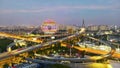 The building Guangzhou Circle and the nearby highways at dusk