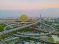 The building Guangzhou Circle and the nearby highways at sunset