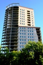 Building high-rise building made of concrete against the blue sky Royalty Free Stock Photo