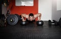Building his upper body. Full length shot of a handsome and muscular young man working out with a medicine ball in the Royalty Free Stock Photo