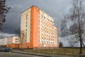 Dormitory of doctors and medical workers in Gomel. The multi-storey building is orange-yellow