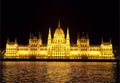 The building of the Hungarian Parliament at night and its reflection in the water of the Danube river. Budapest, Royalty Free Stock Photo