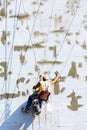 Building industrial worker hanging