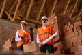 Site supervisor and foreman posing for camera during construction inspection Royalty Free Stock Photo