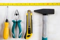 Building instrument set, tape measure, pliers, screwdriver, ruler, hammer and utility knife Royalty Free Stock Photo