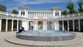 The building of the Kislovodsk Colonnade on a Sunny spring day and teenagers next to the fountain Royalty Free Stock Photo