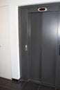 Building lift Elevator Doors Closed grey in white wall