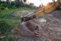 Building Machines: Digger loading trucks with soil. Excavator loading sand into a dump truck. Work in the quarry. Royalty Free Stock Photo