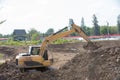 Building Machines: Digger loading trucks with soil. Excavator loading sand into a dump truck. Work in the quarry. Royalty Free Stock Photo