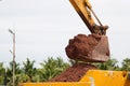 Building Machines: Digger loading trucks with soil. Excavator loading sand into a dump truck. Royalty Free Stock Photo