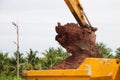 Building Machines: Digger loading trucks with soil. Excavator loading sand into a dump truck. Royalty Free Stock Photo