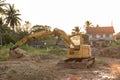 Building Machines: Digger loading trucks with soil. Excavator loading sand into a dump truck. Work in the quarry. Royalty Free Stock Photo