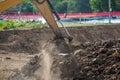 Building Machines: Digger loading trucks with soil. Excavator loading sand into a dump truck. Work in the quarry. Royalty Free Stock Photo