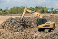 Building Machines: Digger loading trucks with soil. Excavator loading sand into a dump truck. Work in the quarry. Royalty Free Stock Photo