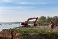 Building Machines: Digger loading trucks with soil. Excavator loading sand into a dump truck. Royalty Free Stock Photo