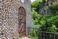 The building made of large river stones is traditional for nations of the Caucasus Royalty Free Stock Photo