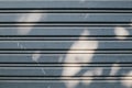 Building made of old roller door corrugated metal sheet,Slide door with shadow and light on surface.Life style, storage, moving, s Royalty Free Stock Photo