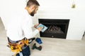 building master examines a new fireplace.