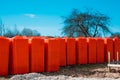 Building materials - aerated concrete blocks for building a house on pallets, packed in orange bags from bad weather