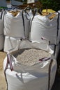 Large sacks of aggregates for making concrete mixes.