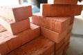 Building materials are on floor, stack red bricks Royalty Free Stock Photo