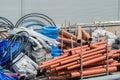 Building materials in the yard. Plastic pipes, hoses, plastic, plastic film, cables, plastic panels in the package, corrugation Royalty Free Stock Photo