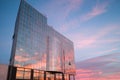 Building with Mirrored Windows Reflecting the Sky at Sunset Royalty Free Stock Photo