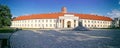 The building of the National Museum of Lithuania in the Old Town of Vilnius, the tower of the Gediminas Castle in the background. Royalty Free Stock Photo