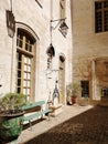 Building near wooden benches and plants under the sunlight at daytime in Avignon in France Royalty Free Stock Photo