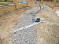 Building new concrete pavement for garden pathway. Foundation for paving with electrical wires and watering equipment garden Royalty Free Stock Photo