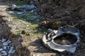 When building a new road, it is necessary to bridge the stream with the help of a metal pipe only for the duration of the construc Royalty Free Stock Photo