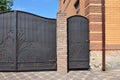 Building New Stone and Metal Fence with Door and Gate for Car. Royalty Free Stock Photo