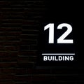 Building number 12. Numberplate